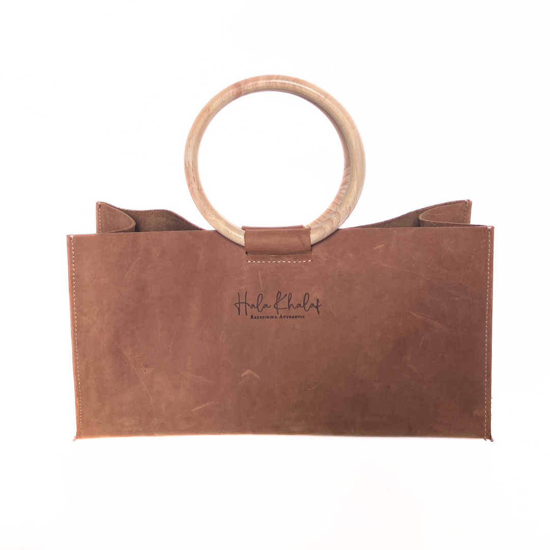 Tan grain leather tote with suede interior and oak wooden handle